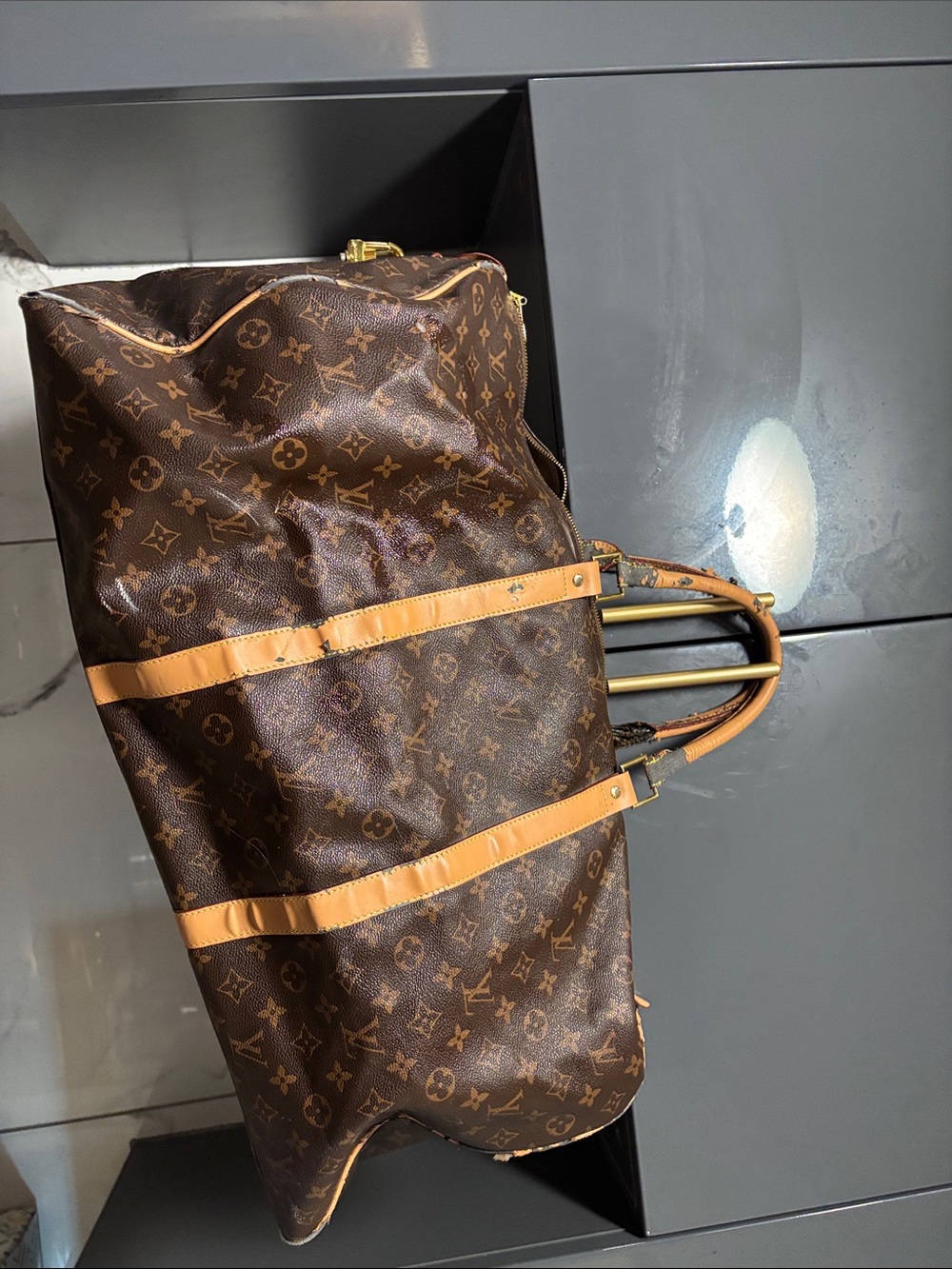 Louis Vuitton Brown Monogram Duffel with Tan Trim w / peelings from LT storage.